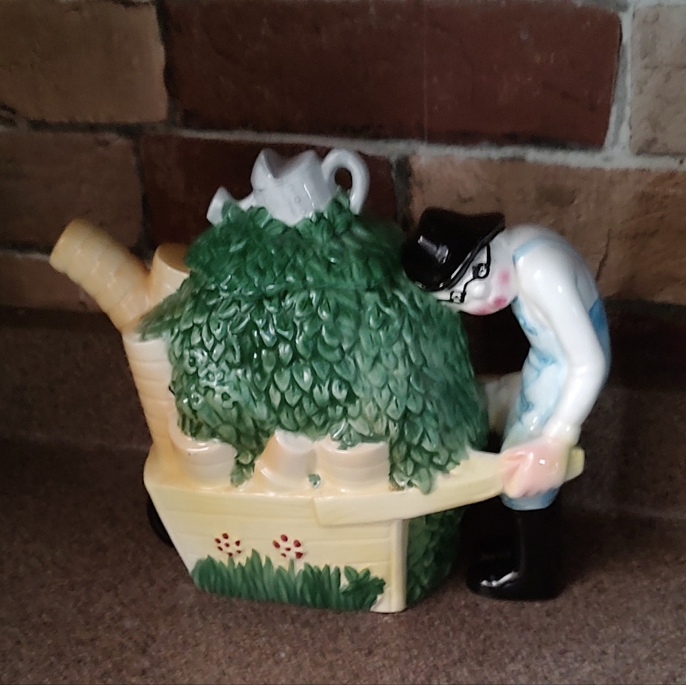 Charming Ceramic Teapot with Whimsical Character And Greenery Design